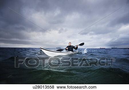 Man in kayak View Large Photo Image Stock Photo - Man in kayak. Fotosearch