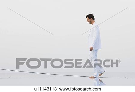 Stock Image - Man in white. Fotosearch