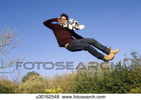 Stock Photo - Man jumping in air. Fotosearch