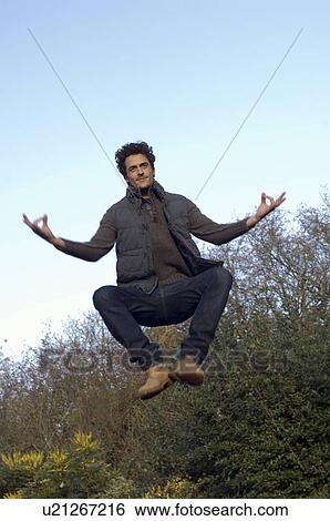 Man jumping in air View Large Photo Image Stock Photograph - Man jumping in air. Fotosearch
