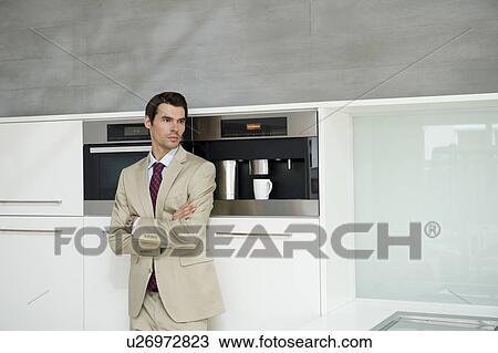 Man on coffee machine View Large Photo Image Stock Image - Man on coffee machine. Fotosearch
