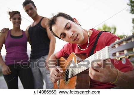 Stock Photo - Man playing guitar. Fotosearch