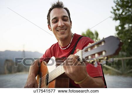 Man playing guitar View Large Photo Image Stock Photo - Man playing guitar. Fotosearch