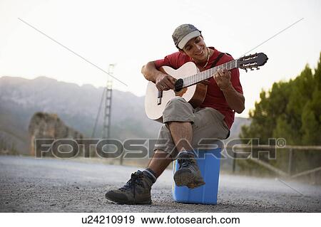 Man playing guitar View Large Photo Image Stock Photo - Man playing guitar. Fotosearch