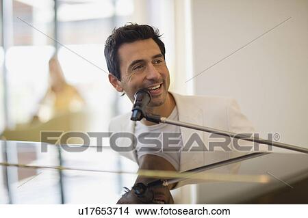 Man playing piano View Large Photo Image Picture - Man playing piano. Fotosearch