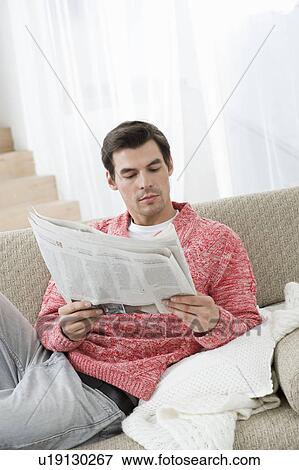 Stock Photo - Man reading newspaper. Fotosearch
