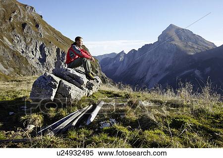 Man relaxing after hill walk View Large Photo Image Stock Photography - Man relaxing after hill walk. Fotosearch