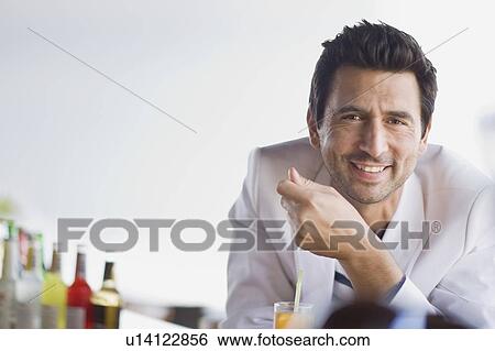 Man sitting at bar View Large Photo Image Stock Photograph - Man sitting at bar. Fotosearch