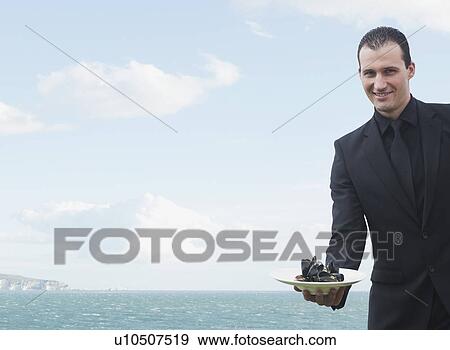 Stock Photo - Man smiling to camera. Fotosearch