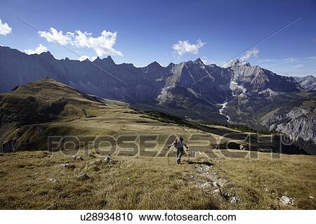 Man walking in the Mountains View Large Photo Image Stock Image - Man walking in the Mountains. Fotosearch