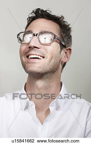 Man with reflections in glasses View Large Photo Image Stock Image - Man with reflections in glasses. Fotosearch