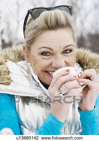 Mature lady drinking tee View Large Photo Image Stock Image - Mature lady drinking tee. Fotosearch