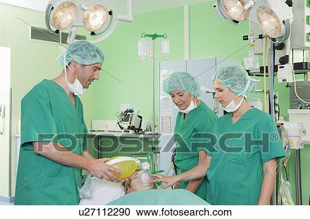 Medical team ventilating patient View Large Photo Image Stock Image - Medical team ventilating patient. Fotosearch