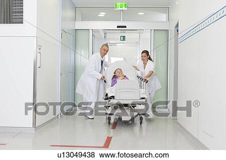 Medical team with couch rushing View Large Photo Image Stock Photo - Medical team with couch rushing. Fotosearch
