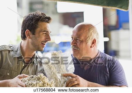 Picture - Men selling fruits. Fotosearch