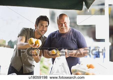 Men selling oranges View Large Photo Image Stock Photo - Men selling oranges. Fotosearch