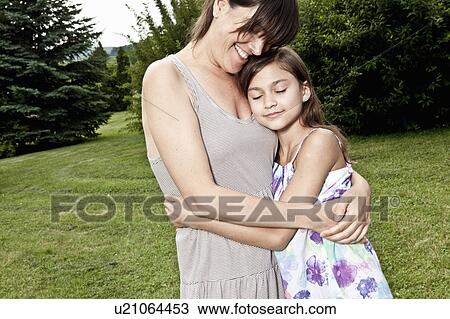 Mother and daughter embrace View Large Photo Image Stock Image - Mother and daughter embrace. Fotosearch
