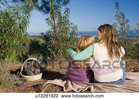 Mother and daughter hugging rural scene View Large Photo Image Stock Image - Mother and daughter hugging rural scene. Fotosearch