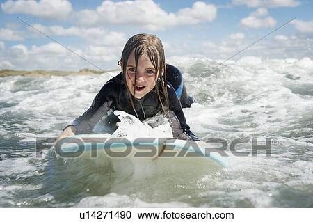 Mother and daughter surfing View Large Photo Image Stock Image - Mother and daughter surfing. Fotosearch