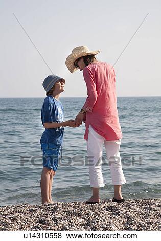 Stock Photo - Mother and son by sea. Fotosearch