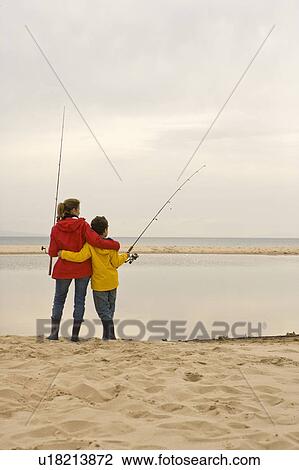 Mother and son fishing at beach View Large Photo Image Stock Image - Mother and son fishing at beach. Fotosearch