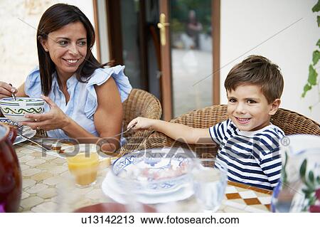 Mother and son having lunch View Large Photo Image Stock Image - Mother and son having lunch. Fotosearch