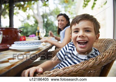 Stock Photography - Mother and son having lunch. Fotosearch