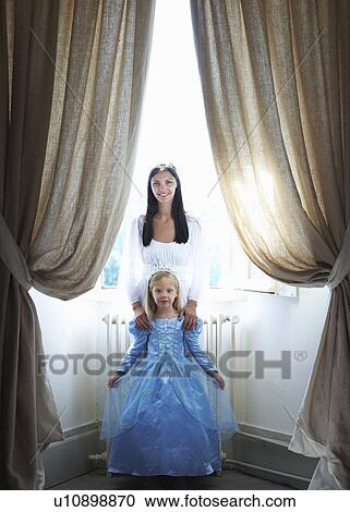 Stock Image - Mother & daughter dressed as princesses. Fotosearch