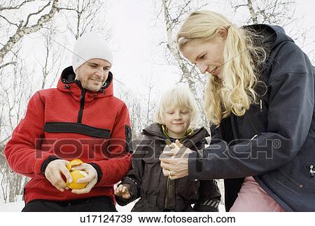 Stock Photo - Mother peeling fruit. Fotosearch