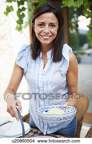 Mother serving food View Large Photo Image Picture - Mother serving food. Fotosearch
