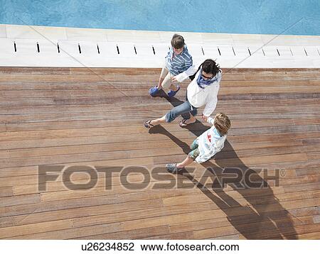 Mother walking with sons, aerial view View Large Photo Image Stock Image - Mother walking with sons, aerial view. Fotosearch