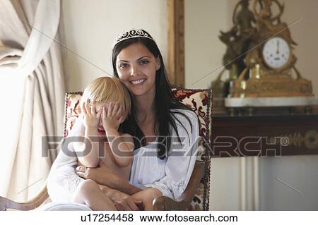 Stock Photo - Mother with her baby boy, smiling. Fotosearch