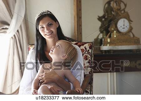 Mother with her baby boy, smiling View Large Photo Image Stock Photo - Mother with her baby boy, smiling. Fotosearch