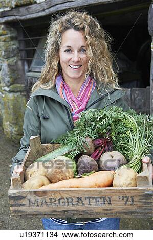 Picture - Mother with vegetables. Fotosearch
