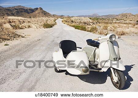 Stock Photo - Motorbike and side car on the road. Fotosearch