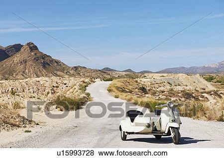 Motorbike and sidecar on the road View Large Photo Image Stock Photo - Motorbike and sidecar on the road. Fotosearch