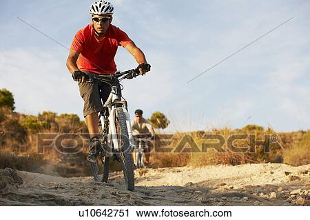 Stock Image - Mountain Biking. Fotosearch