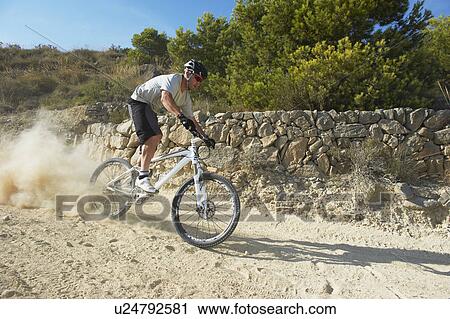 Stock Image - Mountain Biking. Fotosearch