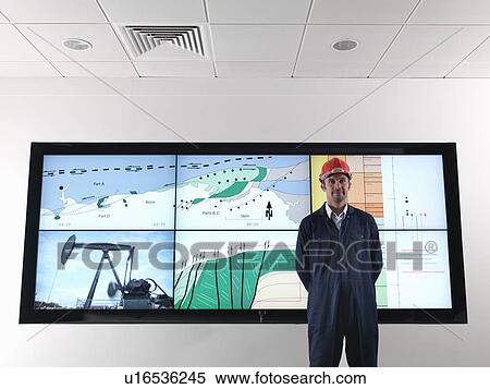 Stock Photography - Oil worker with geology screen. Fotosearch