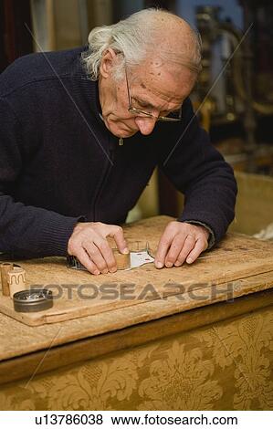 Stock Photo - Old artificer doing his job. Fotosearch