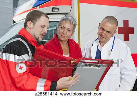 Paramedic doctor and patient examining View Large Photo Image Picture - Paramedic doctor and patient examining. Fotosearch