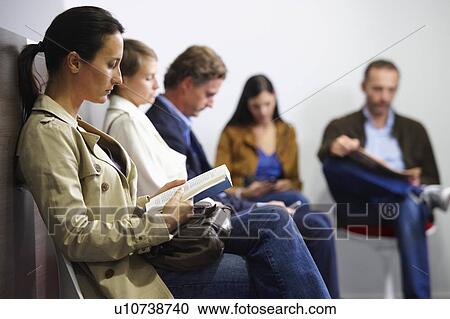 Stock Image - People sitting in waiting room. Fotosearch