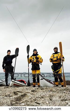 Stock Image - Portrait of 3 kaykers. Fotosearch
