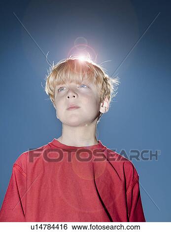 Portrait of boy against blue sky View Large Photo Image Stock Photograph - Portrait of boy against blue sky. Fotosearch