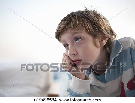 Portrait of boy looking bored View Large Photo Image Picture - Portrait of boy looking bored. Fotosearch