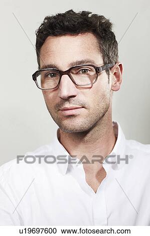 Portrait of man with glasses View Large Photo Image Stock Image - Portrait of man with glasses. Fotosearch