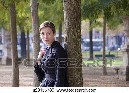 Portrait of woman in Paris park View Large Photo Image Stock Photo - Portrait of woman in Paris park. Fotosearch