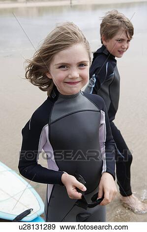 Portrait of young surfer on beach View Large Photo Image Stock Photo - Portrait of young surfer on beach. Fotosearch