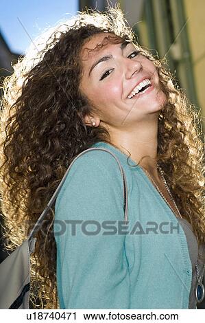 Portrait young woman laughs in street View Large Photo Image Stock Image - Portrait young woman laughs in street. Fotosearch