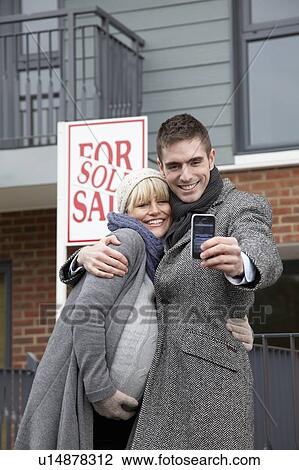 Pregnant couple with new apartment View Large Photo Image Stock Image - Pregnant couple with new apartment. Fotosearch
